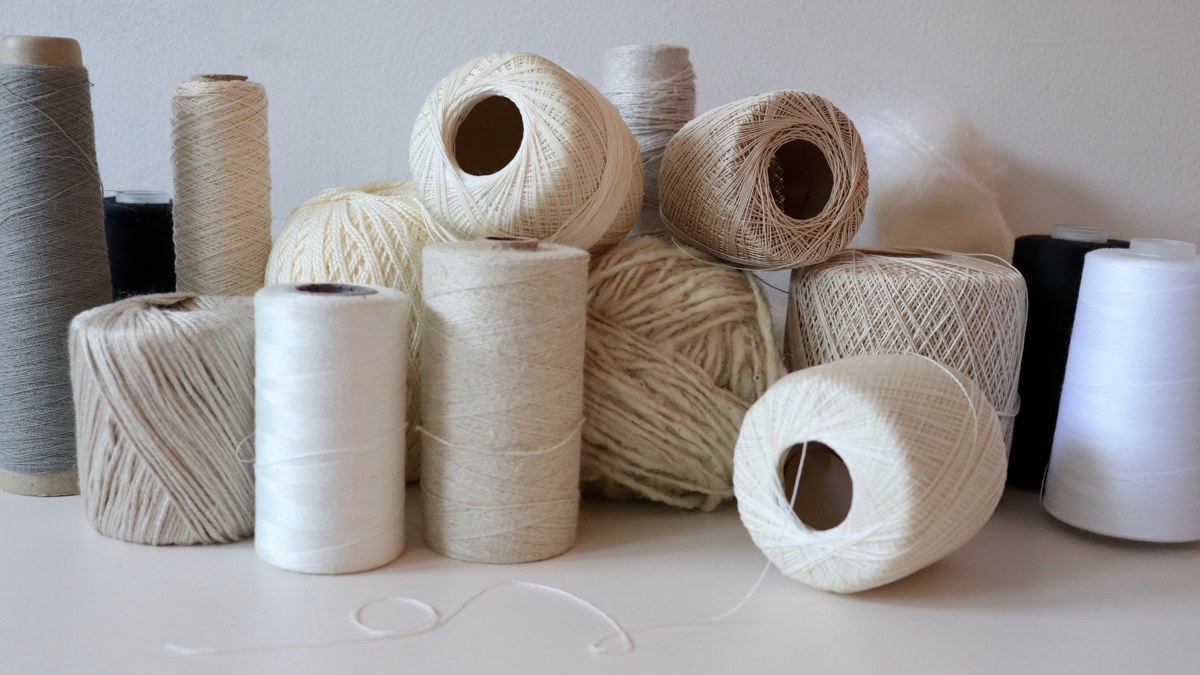 Spools of natural yarn for textile development